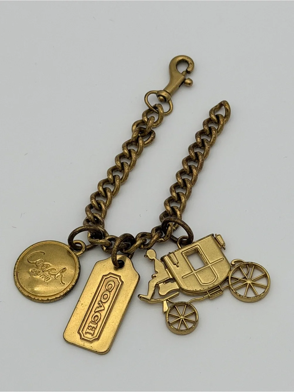 COACH Brass Charm Bracelet with Coach Tags & Horse Carriage Charm
